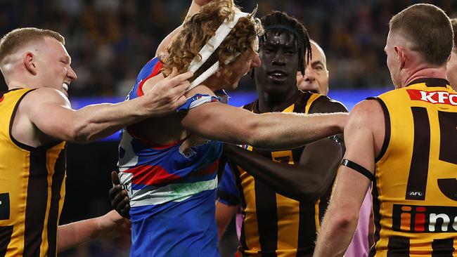 James Sicily pulls off Bulldog Aaron Naughton’s headband during a third quarter melee. Picture: Michael Klein