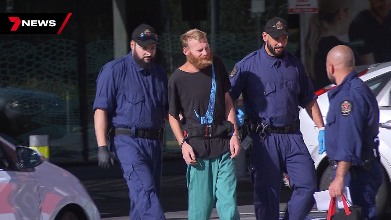 Police escort murder-accused Kristopher Steele to jail from the Royal Adelaide Hospital. Picture: 7 News Adelaide