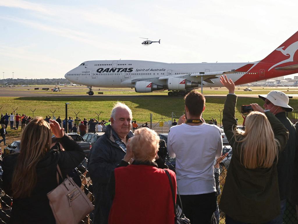 Scott Morrison said the international border would begin reopening in November for states that reach the 80 per cent vaccination coverage target. Picture: Peter PARKS / AFP.