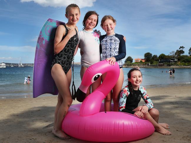 Charlotte Pritchard, 10, Lucy Breen, 11, Sophie Breen, 9, and Jorgia Eyles, 11, all of Hobart, cool off at Long Beach in Sandy Bay. Picture: Nikki Davis-Jones