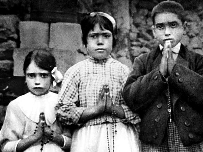 The three Portuguese shepherd children Lucia Dos Santos (C) and her cousins Jacinta (L) and Francisco Marto who had visions of The Virgin Mary at the Village of Fatima in 1917.