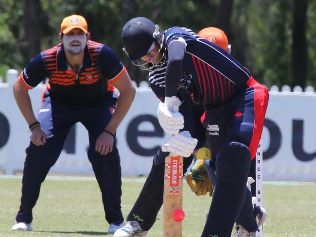 Mudgeeraba batsman Lydon Gibbons defends against Runaway Bay in a first grade clash. Pic Mike Batterham.