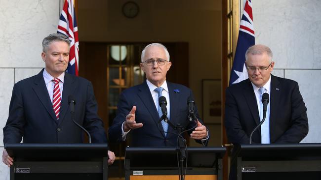 Finance Minister Mathias Cormann, left, Malcolm Turnbull and Treasurer Scott Morrison hold their media conference at Parliament House. Picture: Kym Smith