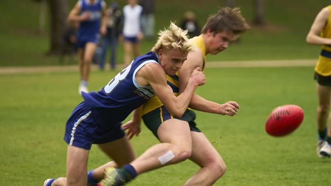 Sacred Heart’s Jacob Ryan tackles Pembroke’s Josh Angus in their round five clash. Picture: Matt Loxton