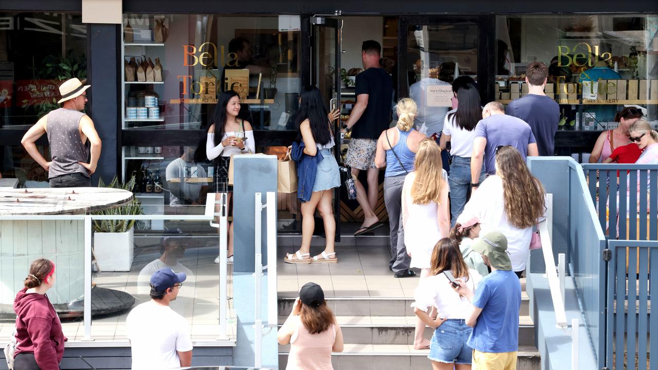 A crowd gathers at Bella and Tortie on Sunday ahead of its closure. Picture: Steve Pohlner