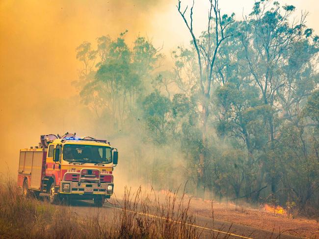 Firefighters working to control a bushfire in Deepwater, Central Queensland. Picture: AAP Image/QFES Media