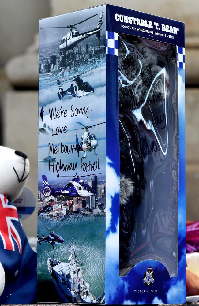 Police members leave a tribute. Picture: Nicole Garmston