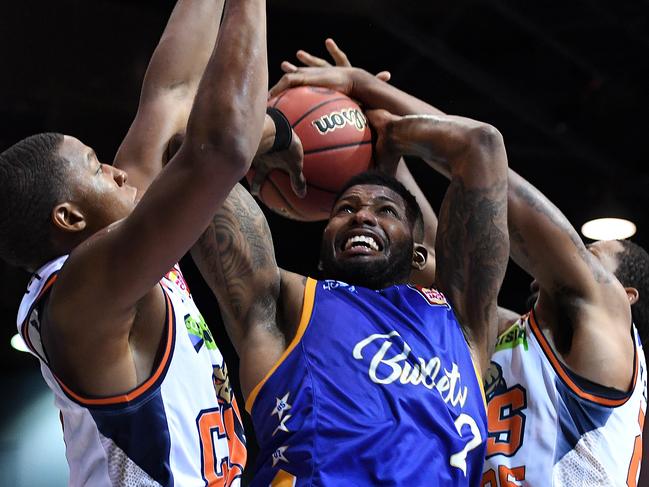 Brisbane Bullets star Alonzo Gee is blocked by the Cairns Taipans defence on Saturday night. Picture: AAP