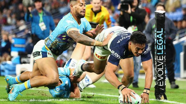 Murray Taulagi scored one of the Cowboys’ six tries against the Titans. Picture: Chris Hyde/Getty Images