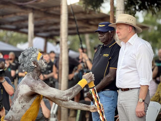 Garma Festival 2024, Gulkula, East Arnhem NT. Chairman of the Yothu Yindi Foundation Djawa Yunupingu and Prime Minister Anthony Albanese watch on as Yolngu people perform traditional dance on the Bunggul grounds for the official opening ceremony of Garma Festival. Picture: Fia Walsh.