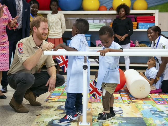 Prince Harry meets Barnaby Jose Mar, 6, as he visits the Princess Diana Orthopaedic Centre in Huambo, Angola. Picture: AP