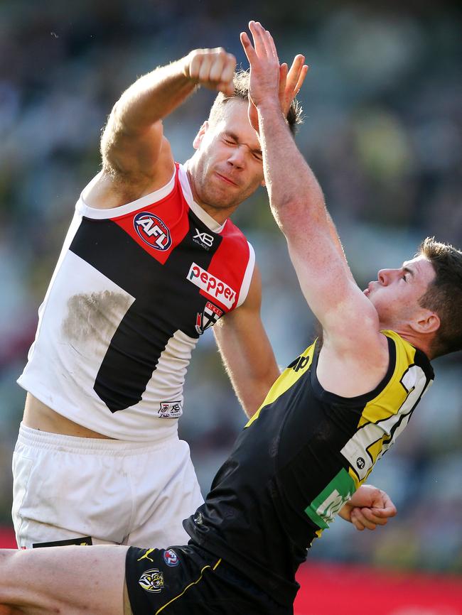 Bailey Rice punches the ball away from Richmond's Jack Higgins.