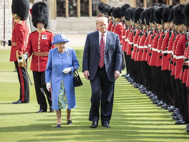 US President Donald Trump and Queen Elizabeth II inspect a Guard of Honour, formed of the Coldstream Guards at Windsor Castle.