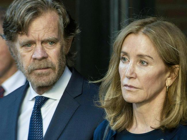 Actress Felicity Huffman, with husband, actor William H. Macy, received a two-week prison term for her role in a college admissions scam. Picture: Getty Images