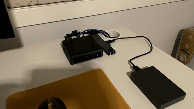 This small NUC is powerful yet hardly takes up any room on the desktop. It is attached to an external drive and a hub for extra ports.