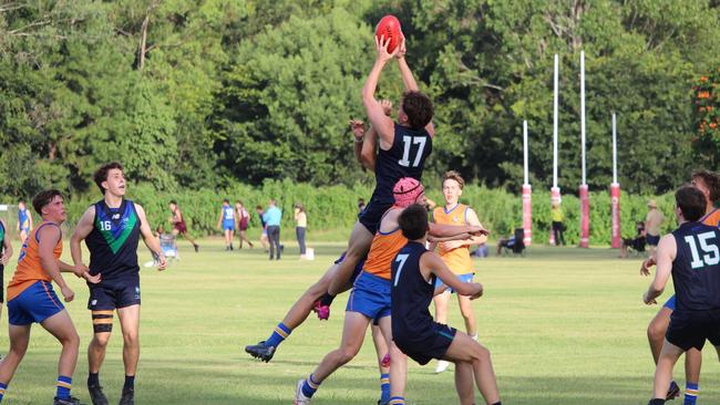 Ambrose Treacy's Spencer Glover soars above the pack. Image: Sue Middelton.