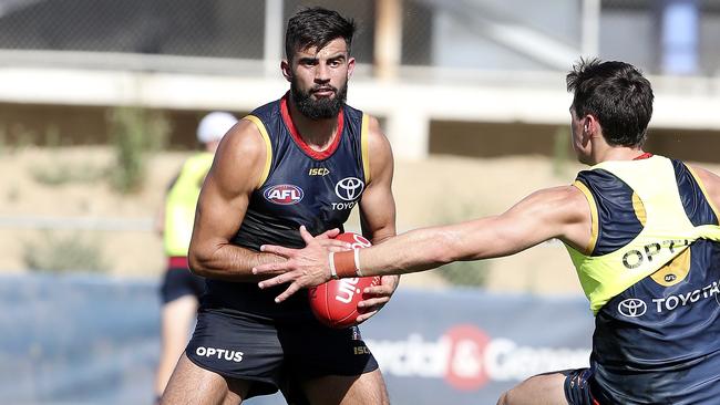 Wayne Milera dodges Jake Kelly’s attempted tackle at Adelaide training.