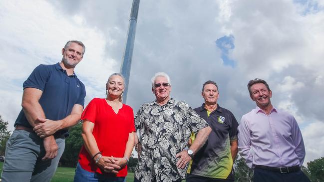 Member for Johnston Joel Bowden, Minister for Sport Kate Worden, Darwin Lord Mayor Kon Vatskalis, Mindil Aces president David McWilliam and Football NT chief executive Bruce Stalder with one of Bagot Oval’s new light towers. Picture: Glenn Campbell