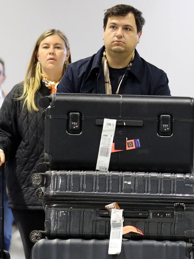 Couple arrived in black: Brittany Higgins and David Sharaz at Charles de Gaulle Airport in Paris. Picture: Mega