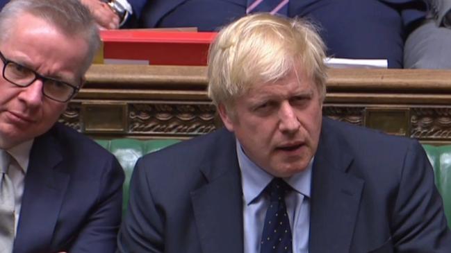 Boris Johnson and Brexit Minister Michael Gove listen as the vote is delivered. Picture: AFP