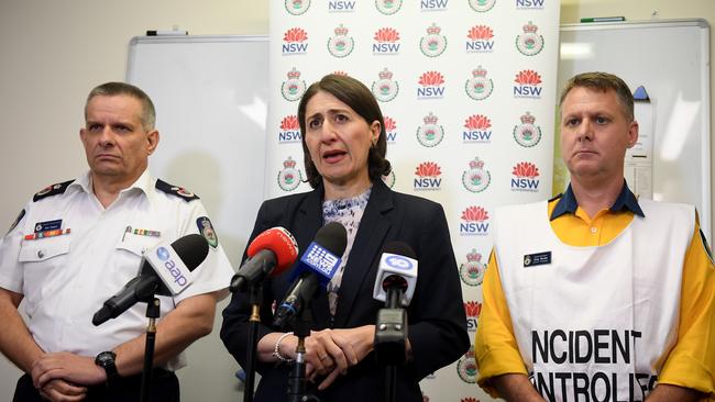 Blue Mountains RFS incident controller Superintendent Greg Wardle is pictured right at Blue Mountains Fire Control Centre on December 23, 2019, with Premier Gladys Berejiklian and RFS Deputy Commissioner Rob Rogers. Picture: AAP Image/Dan Himbrecht