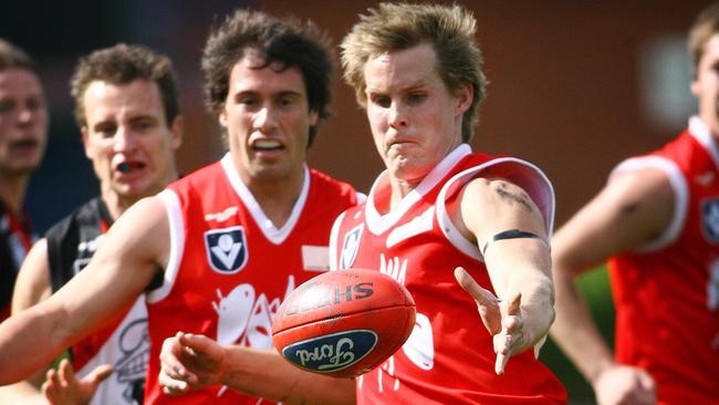 Carlton coach David Teague taking a kick for the Northern Bullants in the famous Ants jumper.