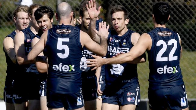 South Adelaide captain Joel Cross is congratulated by teammates after kicking a goal. Picture: Naomi Jellicoe