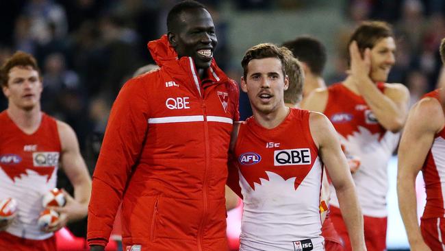 Aliir Aliir all smiles with Jake Lloyd after the game. Picture: Colleen Petch