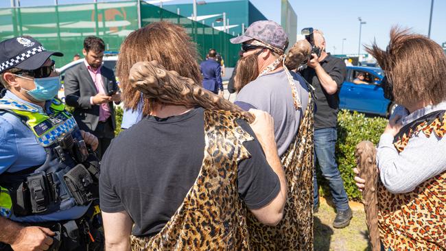 Police speak to the cavemen. Picture: Jason Edwards