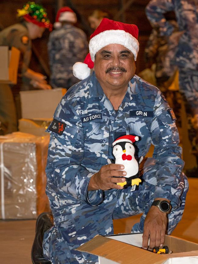 Air Force Flight Lieutenant Norman Grogan from No. 13 Squadron packing donations for Exercise Christmas Hop at RAAF Base Townsville before departing to remote communities.