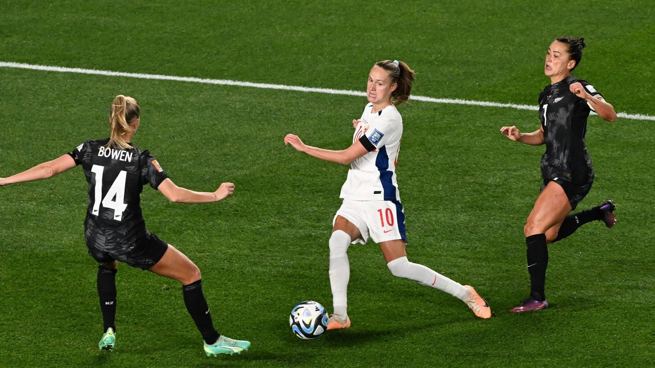 Ali Riley (R) found a way around FIFA’s armband rule by wearing pride-coloured nail polish. Picture: Saeed KHAN / AFP