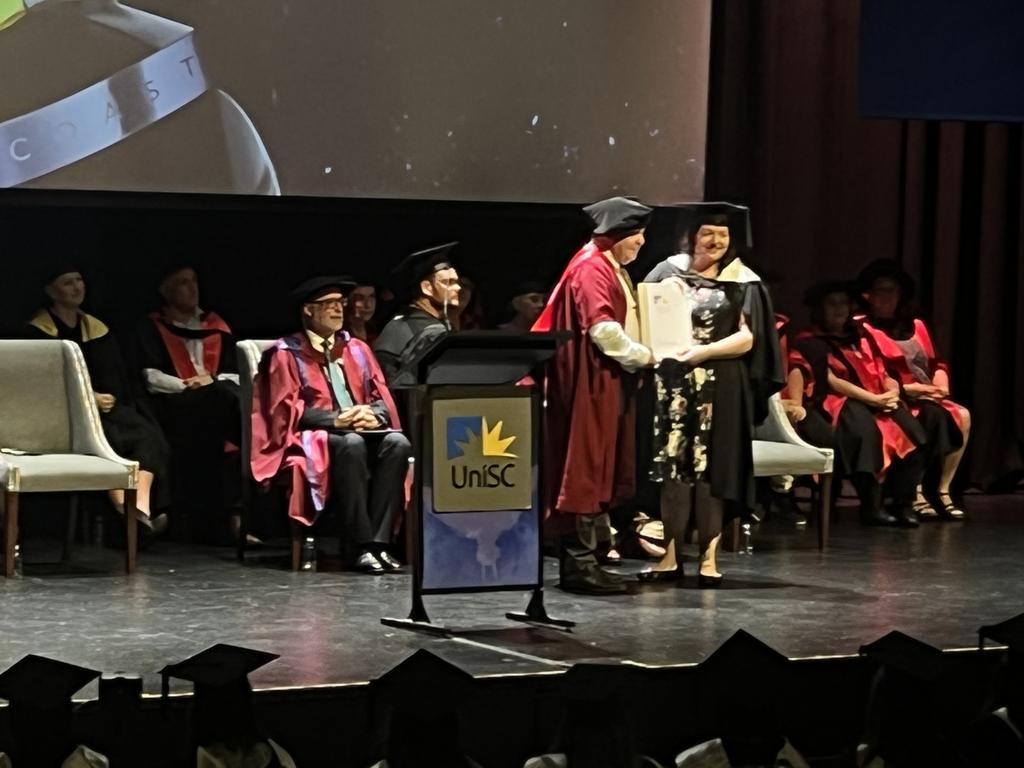 Graduates from the University of the Sunshine Coast's Fraser Coast campus celebrating at the Brolga Theatre.