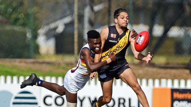 18/08/18 – SANFL: Glenelg v Adelaide at Glenelg Oval. Adelaide's Aron Asfaha tackles Glenelg's Ian Milera. Picture: Tom Huntley