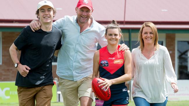 Lily Mithen with Liam Higgins, her dad, Anthony, and mum, Selina. Picture: Jay Town