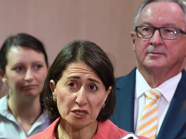 New South Wales Premier Gladys Berejiklian, centre, with Minister for Health Brad Hazzard (right). Picture: Dean Lewins.