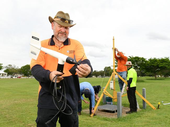 David Henderson, Chief Engineer of the JCU Cyclone Testing, setting up an anemometer in Townsville. Picture: Shae Beplate.