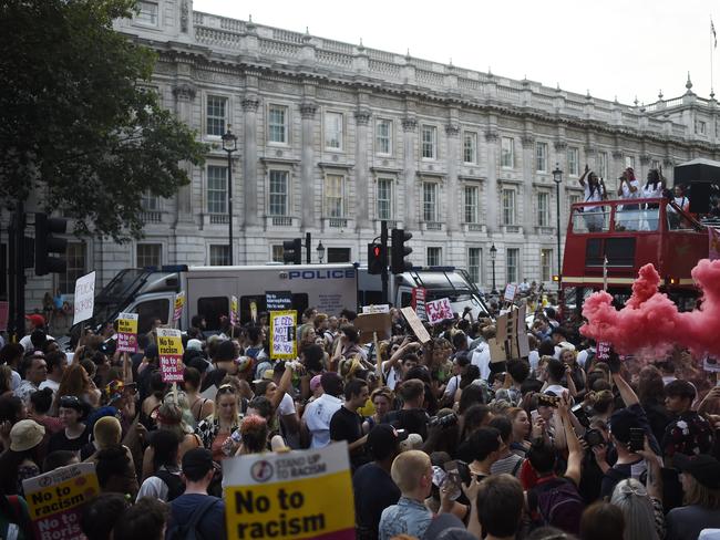 LONDON, ENGLAND - JULY 24: (EDITORS NOTE: IMAGE CONTAINS PROFANITY) Protestors are seen in Whitehall after Prime Minister Boris Johnson arrives back at Downing Street on July 24, 2019 in London, England. Boris Johnson, MP for Uxbridge and South Ruislip, was elected leader of the Conservative and Unionist Party yesterday receiving 66 percent of the votes cast by the Party members. He will take the office of Prime Minister this afternoon after outgoing Prime Minister Theresa May takes questions in the House of Commons for the last time. on July 24, 2019 in London, England. (Photo by Peter Summers/Getty Images)