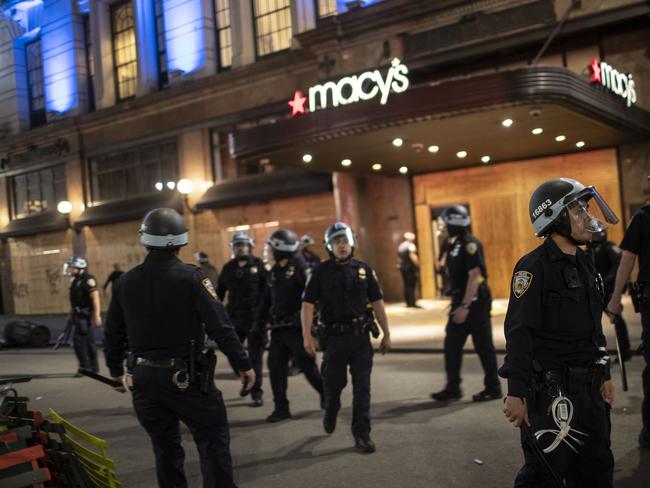 Police arrive at Macy's mall after it was broken into in New York. Picture: AP