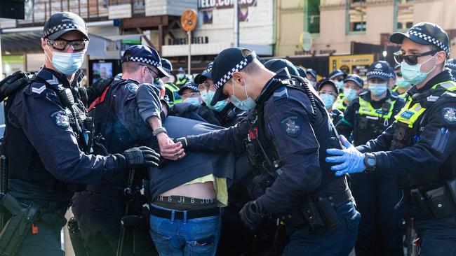 Police move a man away from the protest. Picture: NCA NewsWire/Sarah Matray