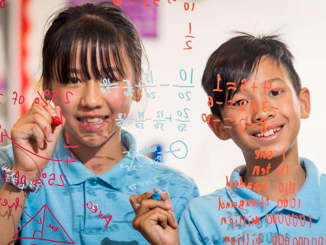 The Government is announcing $60 million in funding for a gifted children's extension program. Wallrano Primary School students Talen Truong, 11 and Ivan Dang, 10 love maths. Picture: Jake Nowakowski