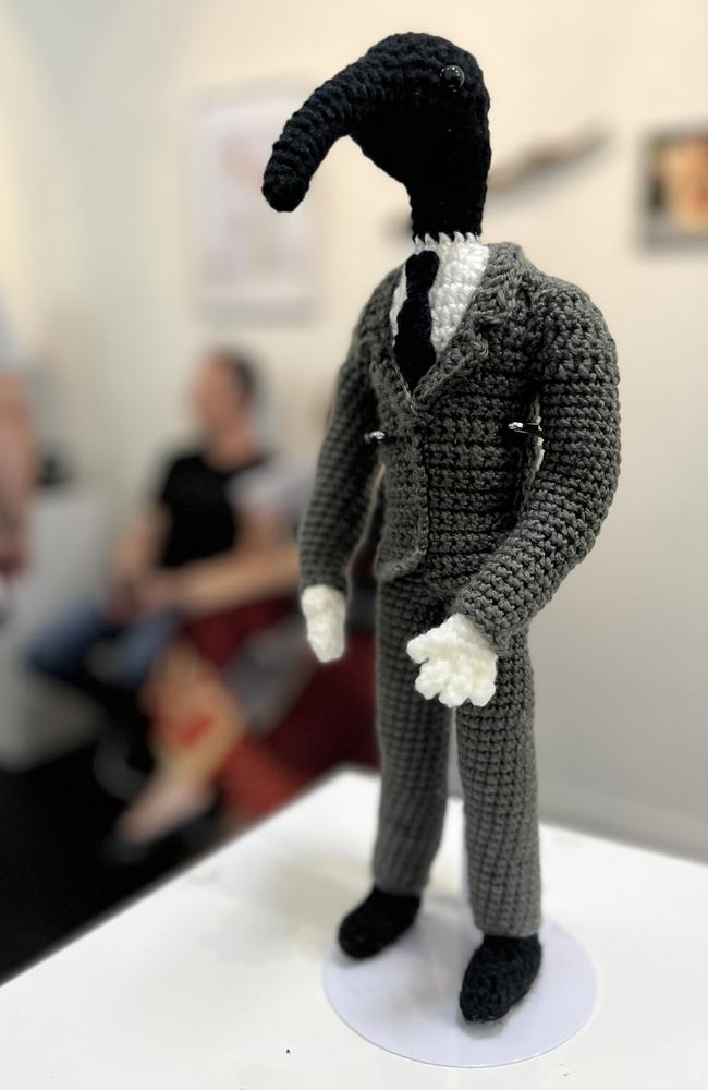 The winning piece of art, iBiz, by u/femlocks, as voted for the community. The image features a crochet figure of an ibis/human hybrid wearing a suit. Picture: Paige Bradford