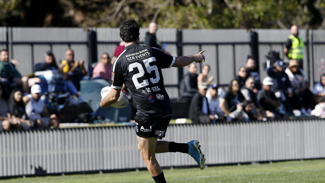 Redfern's Djawinj Gordon with the ball comes in to score. Picture: John Appleyard