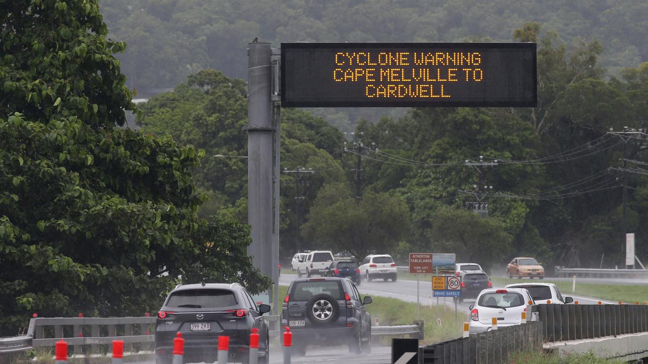 Tropical Cyclone Kimi has formed out in the Coral Sea off Cooktown and is expected to make landfall on Monday. A cyclone warning is broadcast on the road safety electronic sign near the roadworks at the Smithfield Bypass. Picture: Brendan Radke