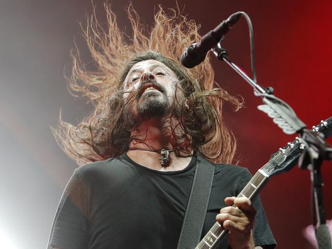 Dave Grohl lets his long locks flow during Foo Fighters’ show at Brisbane’s Suncorp Stadium last night. Picture: Josh Woning/AAP