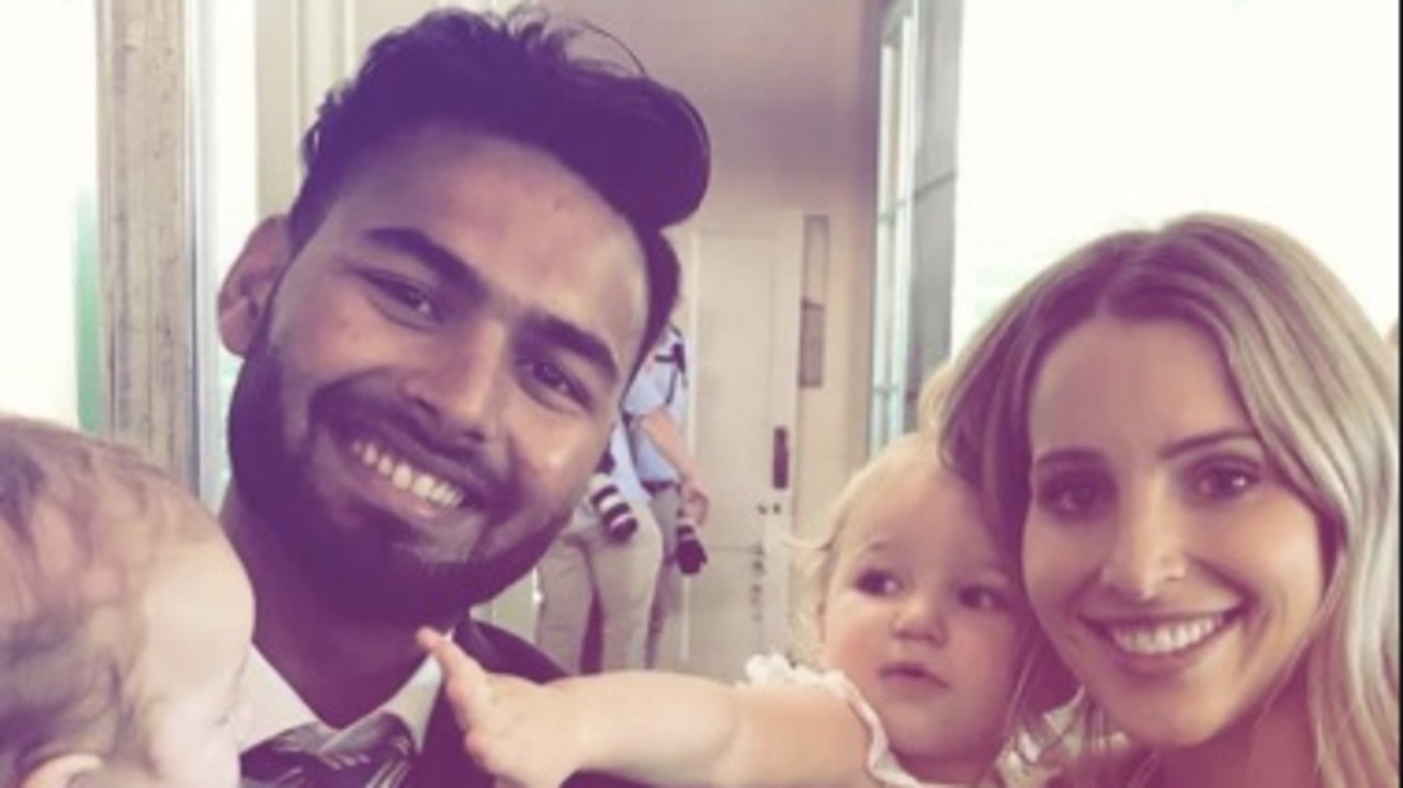 Rishabh Pant poses with Tim Paine's wife Bonnie and their kids.