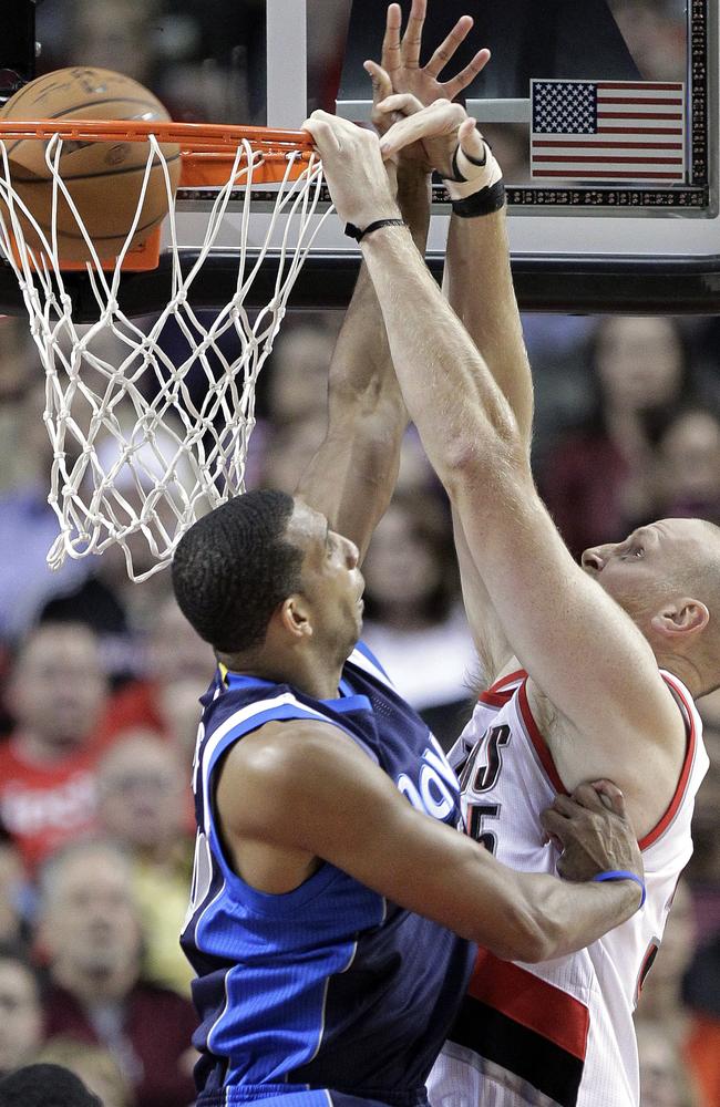 Portland Trail Blazers centre Chris Kaman scores against Dallas Mavericks forward Brandan Wright.