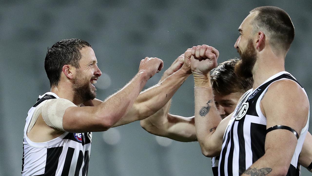 AFL - SHOWDOWN 48 - Port Adelaide v Adelaide Crows at the Adelaide Oval. Travis Boak celebrates his goal with Robbie Gray and Charlie Dixon Picture SARAH REED