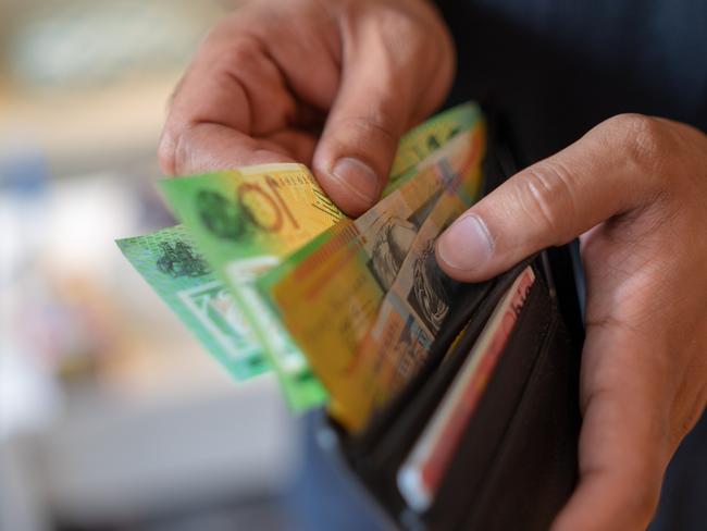 a male taking money out of the valet.  Picture: istock