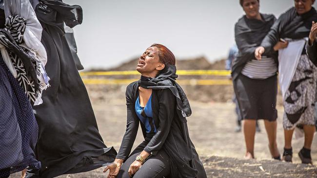 Ethiopian relatives of crash victims mourn and grieve at the scene. Picture: AP/Mulugeta Ayene