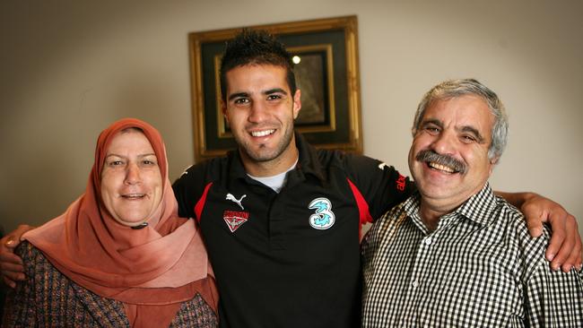 A young Houli with his mum, Yamama, and dad, Malek, on the eve of his debut with Essendon.